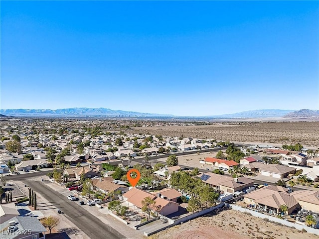 birds eye view of property with a mountain view