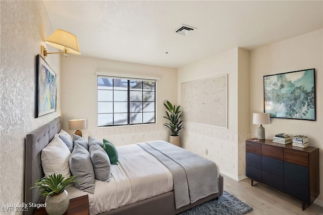 bedroom with light hardwood / wood-style flooring