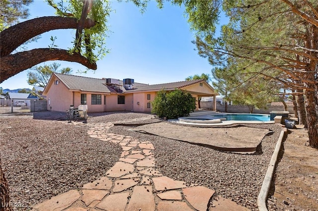 rear view of property featuring a patio