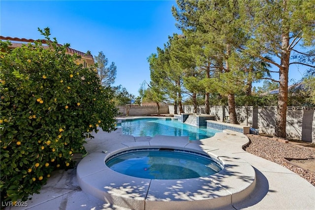 view of pool featuring an in ground hot tub