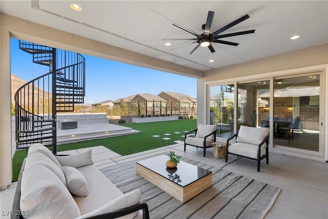 view of patio / terrace with ceiling fan and an outdoor hangout area