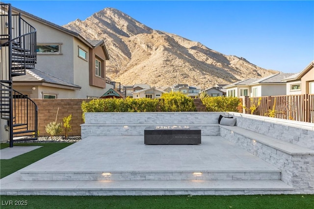 view of patio with a deck with mountain view