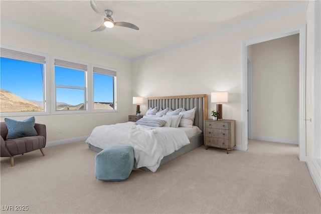 carpeted bedroom featuring ceiling fan and ornamental molding