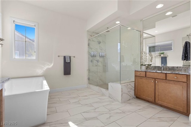 bathroom featuring vanity and shower with separate bathtub