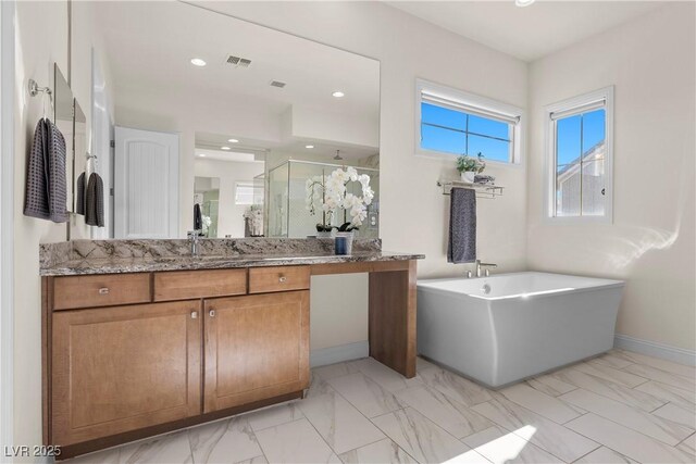 bathroom featuring vanity and plus walk in shower