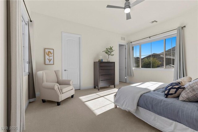 bedroom featuring ceiling fan and light colored carpet