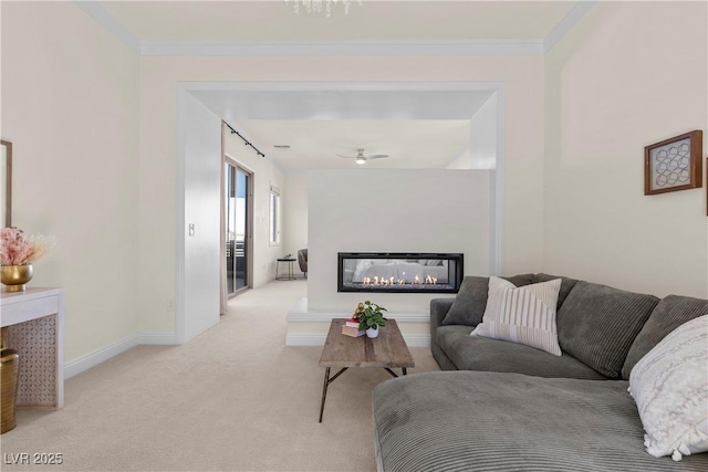 carpeted living room with ceiling fan and crown molding