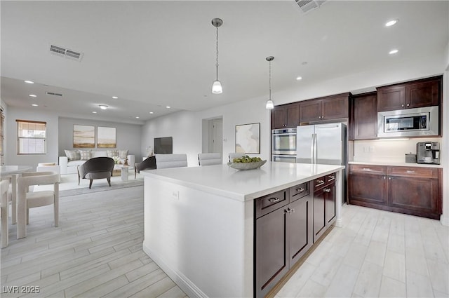 kitchen with visible vents, recessed lighting, stainless steel appliances, and light countertops