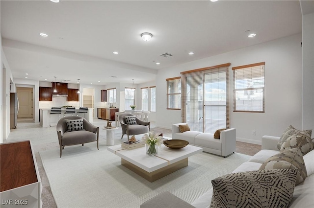 living room featuring visible vents, recessed lighting, and baseboards