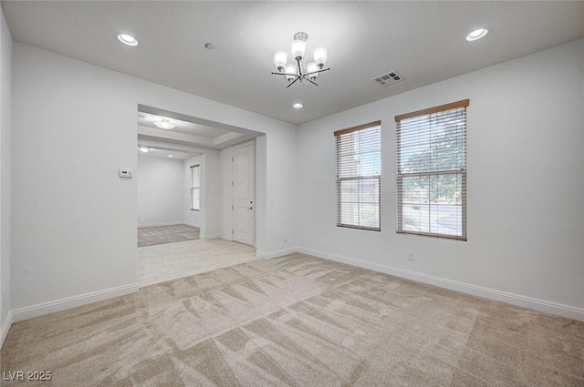 unfurnished room with an inviting chandelier, carpet flooring, recessed lighting, and visible vents