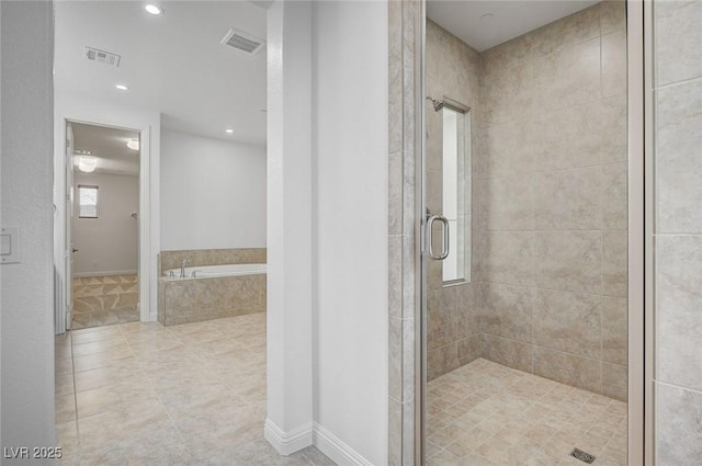 bathroom featuring a bath, recessed lighting, visible vents, and a stall shower