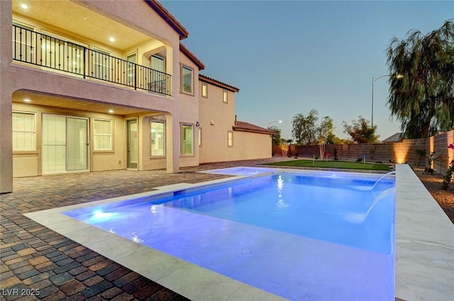 view of pool featuring a fenced in pool, a patio, and a fenced backyard