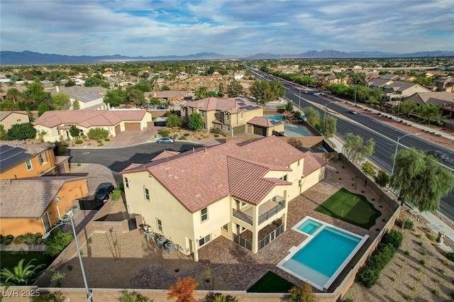 drone / aerial view with a mountain view and a residential view