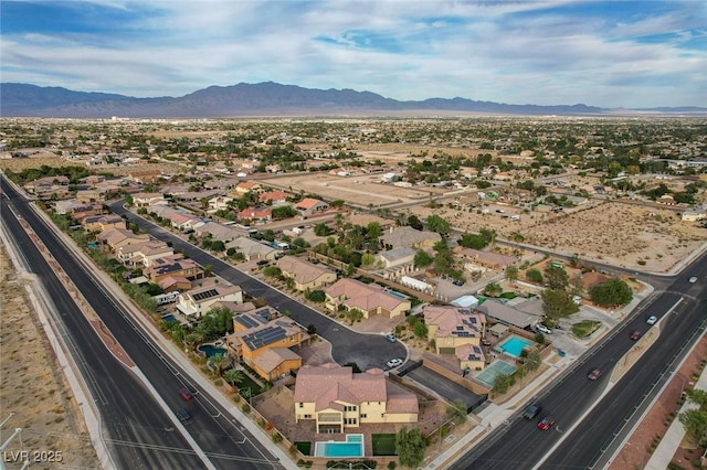 drone / aerial view with a residential view and a mountain view