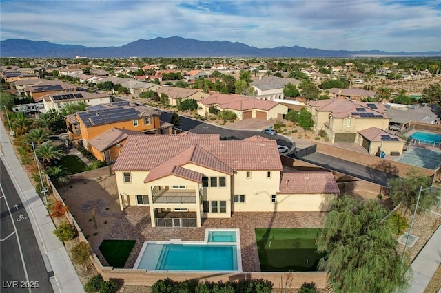 drone / aerial view with a residential view and a mountain view