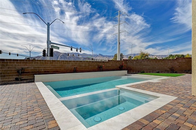 view of pool featuring a patio area, a fenced backyard, and a fenced in pool