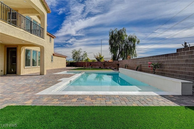 view of pool featuring a fenced in pool, a patio, and a fenced backyard