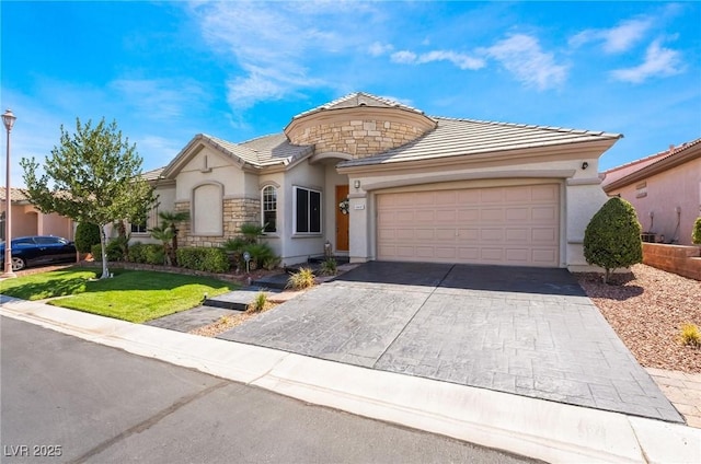 view of front of home with a front lawn and a garage