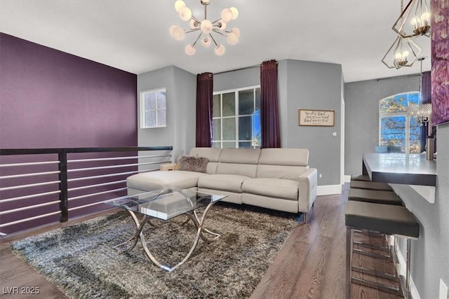 living room with an inviting chandelier and hardwood / wood-style floors