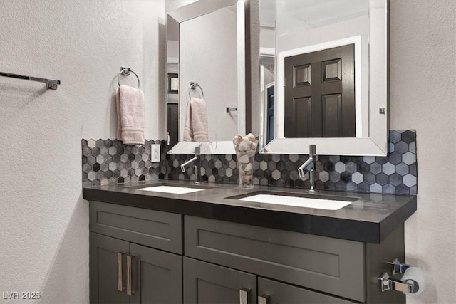 bathroom with vanity and decorative backsplash