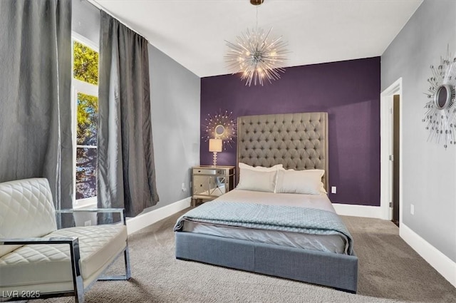 bedroom featuring carpet floors and a chandelier