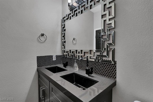 kitchen featuring tasteful backsplash and sink