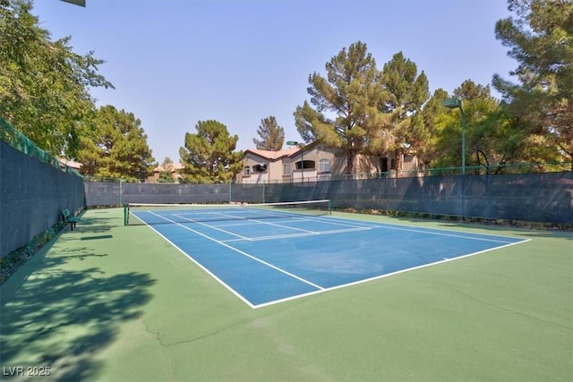 view of sport court with basketball hoop