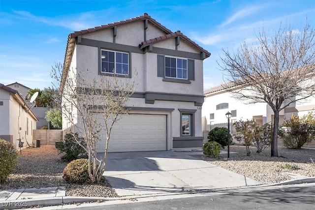 front of property featuring a garage and central air condition unit