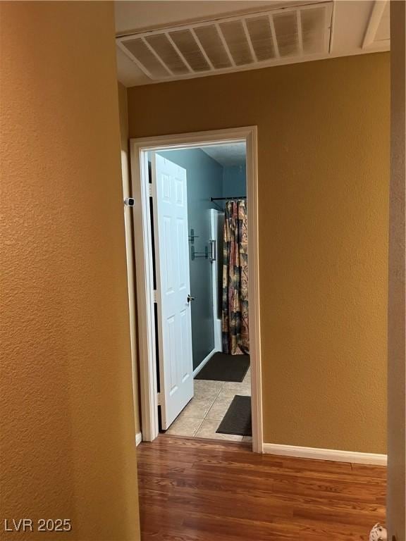 hallway with light wood-type flooring