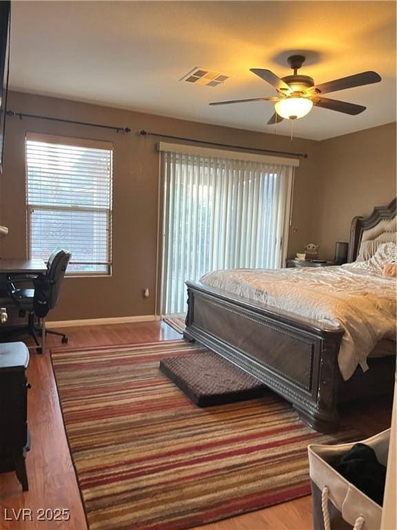 bedroom with ceiling fan and wood-type flooring