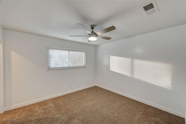 unfurnished room featuring ceiling fan and carpet floors