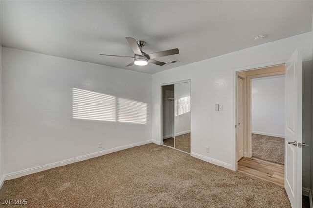 unfurnished bedroom with carpet flooring, a closet, and ceiling fan