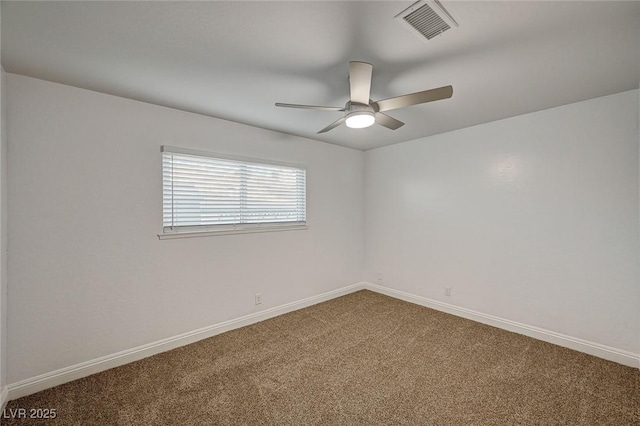 carpeted empty room featuring ceiling fan