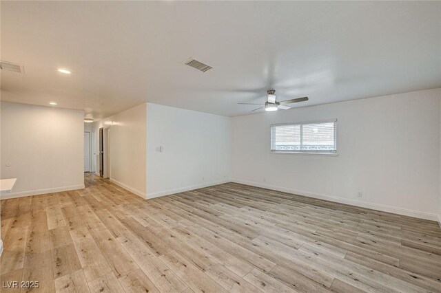 unfurnished room with ceiling fan and light hardwood / wood-style floors