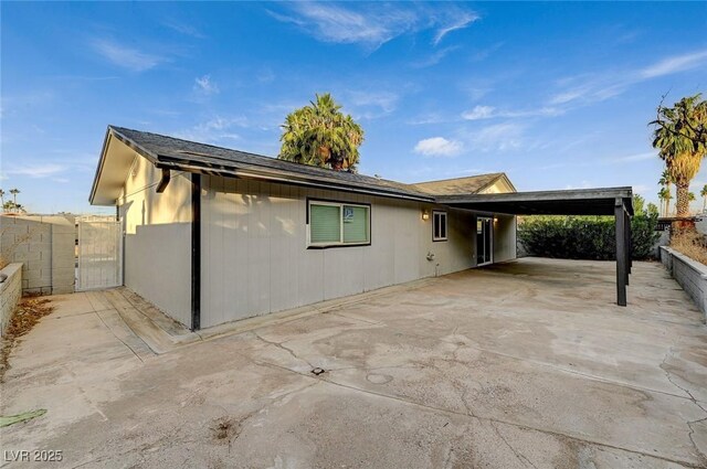 view of home's exterior featuring a carport