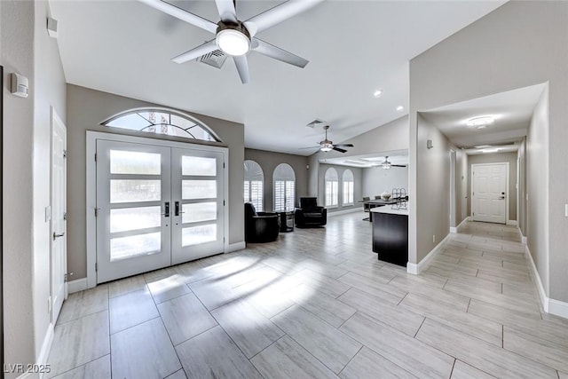 foyer entrance with french doors and lofted ceiling