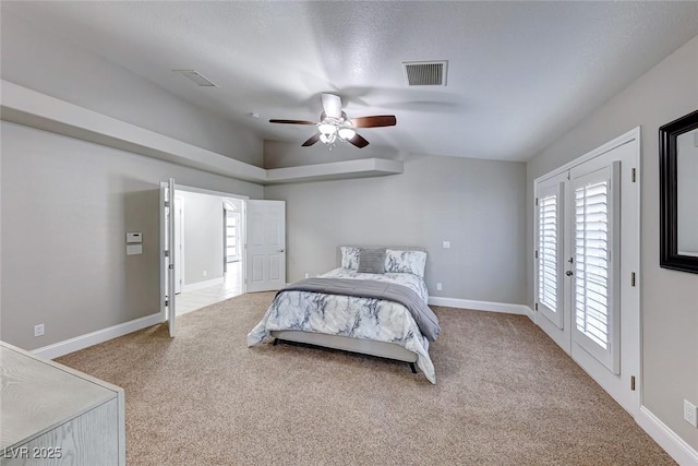 carpeted bedroom with access to exterior, french doors, vaulted ceiling, and ceiling fan