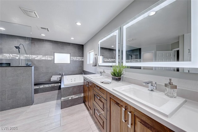 bathroom featuring tile patterned flooring, vanity, and independent shower and bath