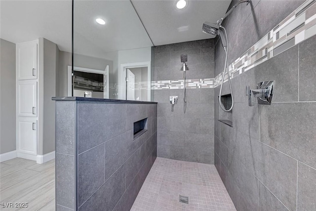 bathroom with tiled shower