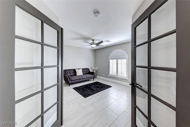 unfurnished room with ceiling fan