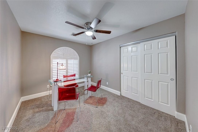 office space featuring carpet and ceiling fan