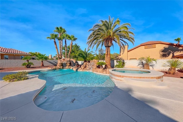 view of pool with an in ground hot tub and pool water feature