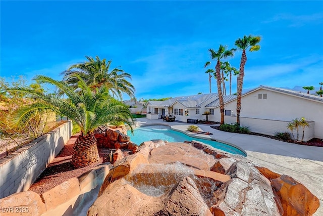 view of swimming pool with a patio area