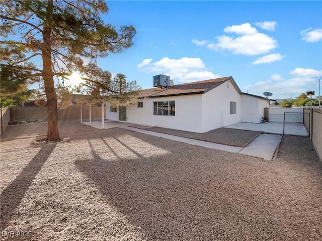 back of property featuring a patio and cooling unit