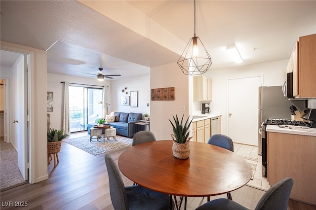 dining area featuring light hardwood / wood-style flooring and ceiling fan