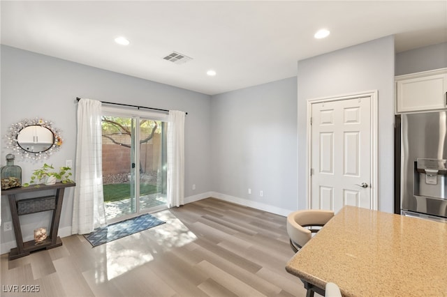 office area with light hardwood / wood-style flooring