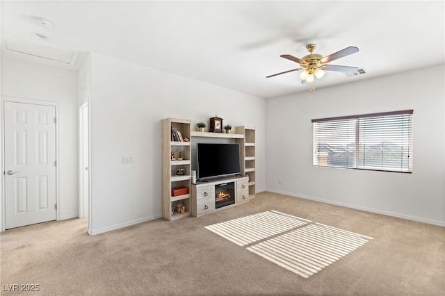 carpeted living room featuring ceiling fan