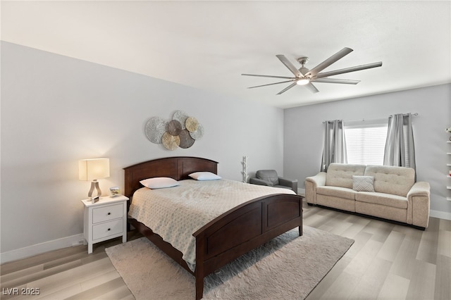 bedroom with light hardwood / wood-style flooring and ceiling fan