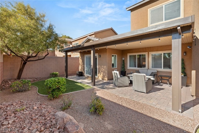 back of property with a patio area and an outdoor hangout area