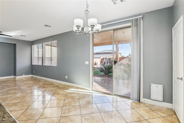 unfurnished dining area featuring ceiling fan with notable chandelier and light tile patterned flooring